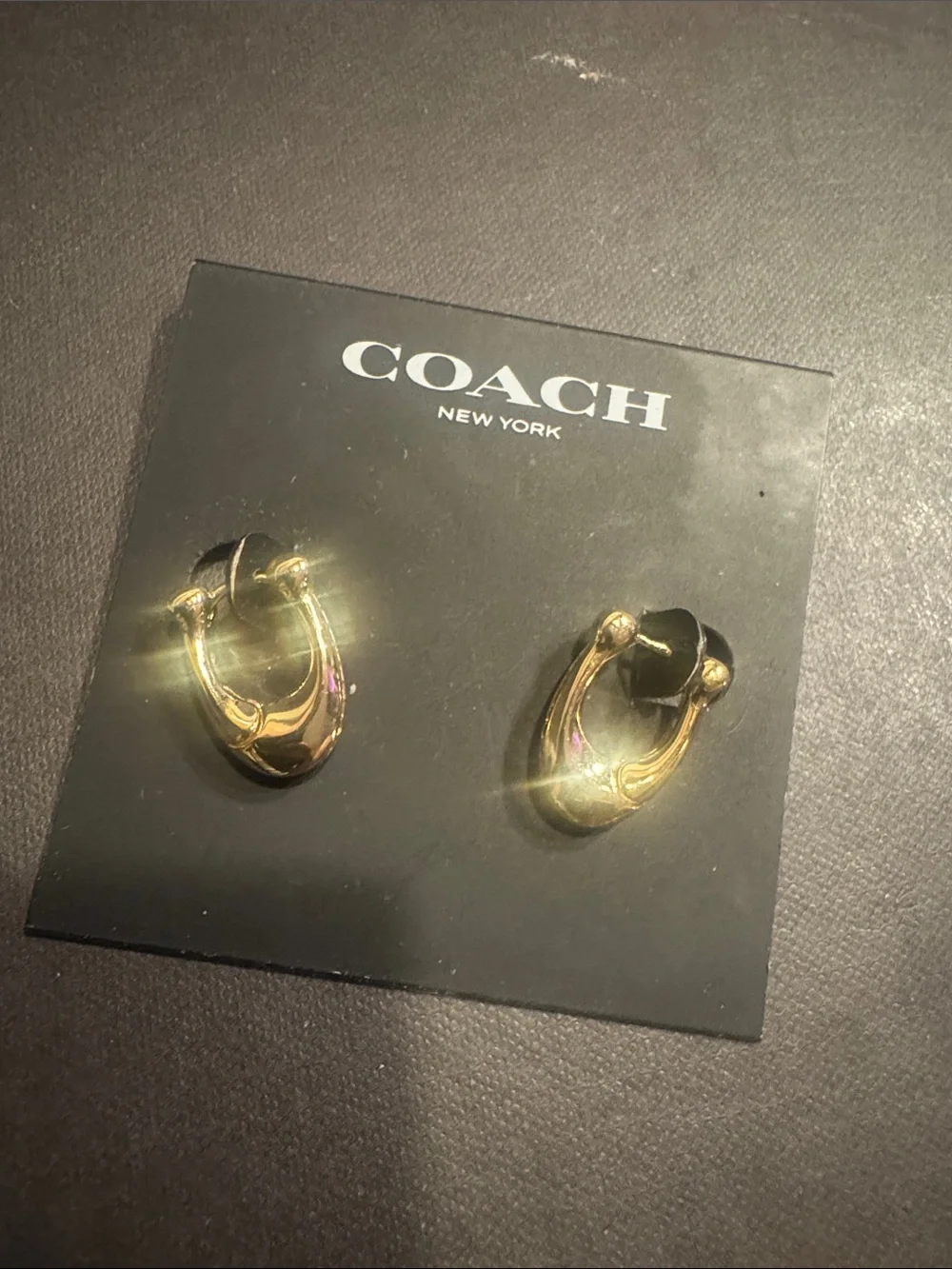 Coach Gold-Tone Interlocking Hoop Stud Earrings - Picture 4 of 4